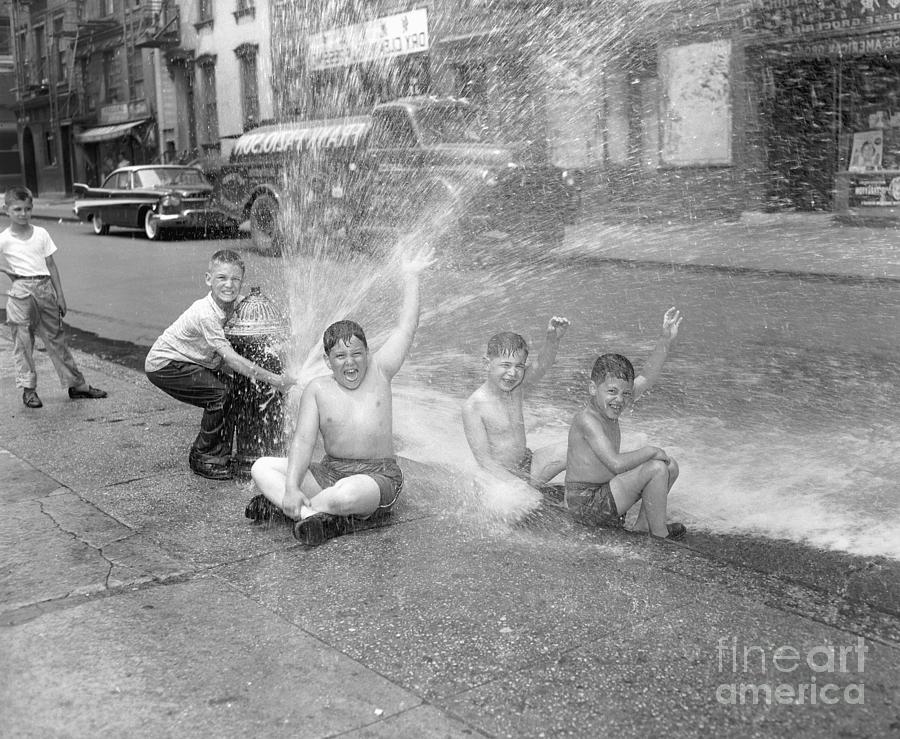 Kids Playing Around Fire Hydrant Photograph by Bettmann