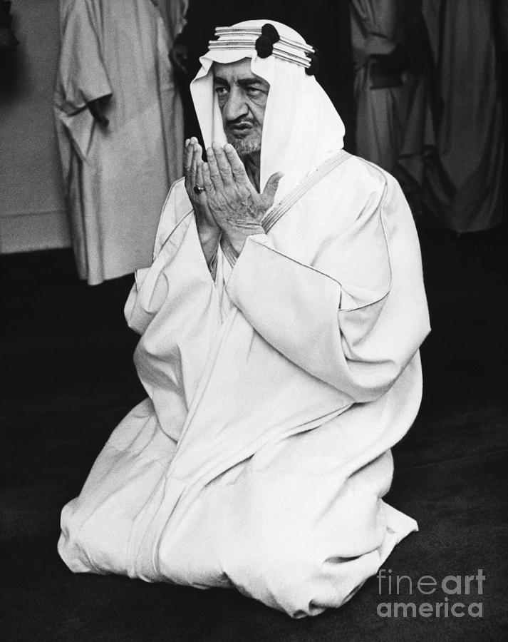 King Faisal Kneels In Prayer Photograph by Bettmann