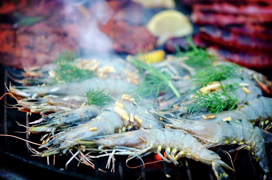King Prawns With Fennel And Lemons On A Barbecue Photograph by Jamie Watson