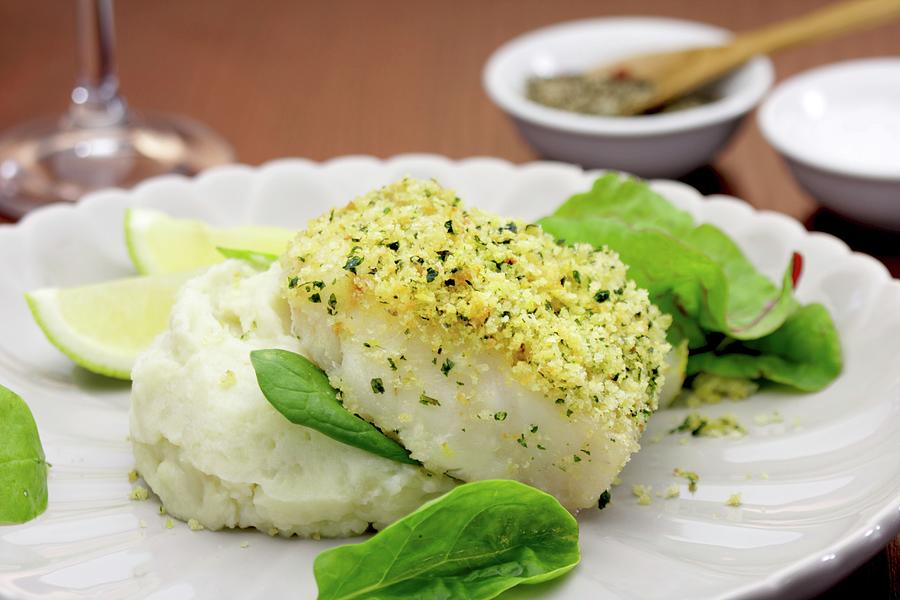Kingklip Fillet south African Cusk Eel With A Lemon And Herb Crust On A Bed Of Celery Puree And Spinach Salad Photograph by Creative Photo Services