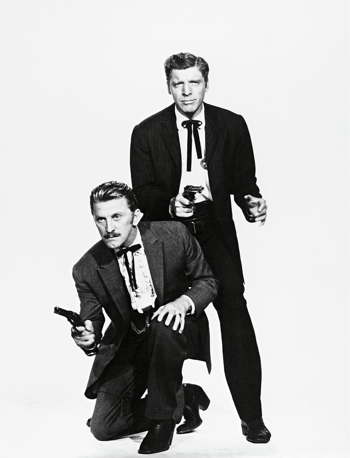 KIRK DOUGLAS and BURT LANCASTER in GUNFIGHT AT THE O. K. CORRAL -1957-. Photograph by Album