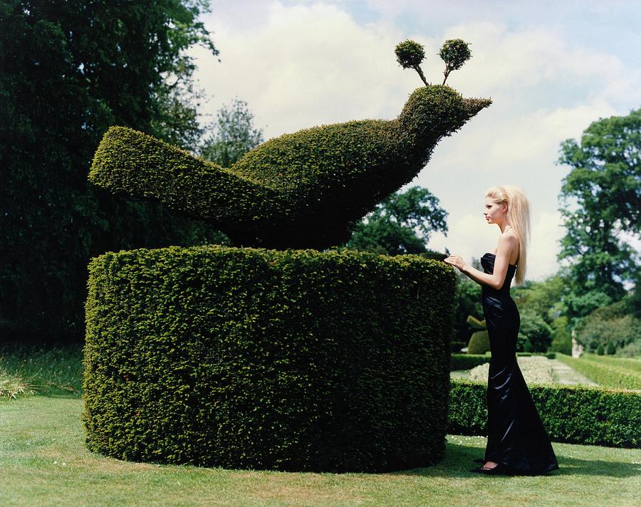 Kirsty Hume With A Topiary Bird Photograph by Arthur Elgort