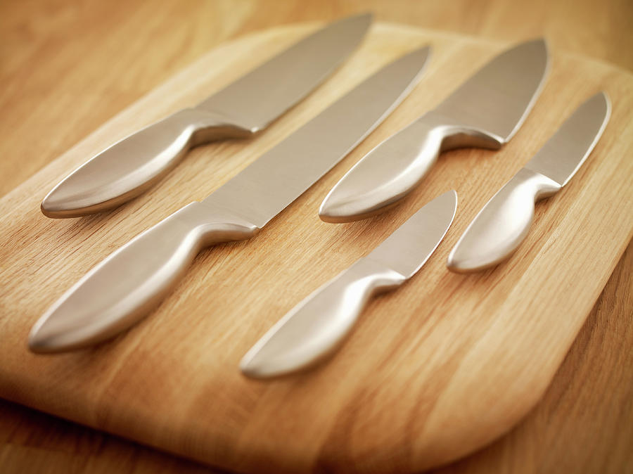 Kitchen Knives On A Wooden Chopping Photograph by Adam Gault