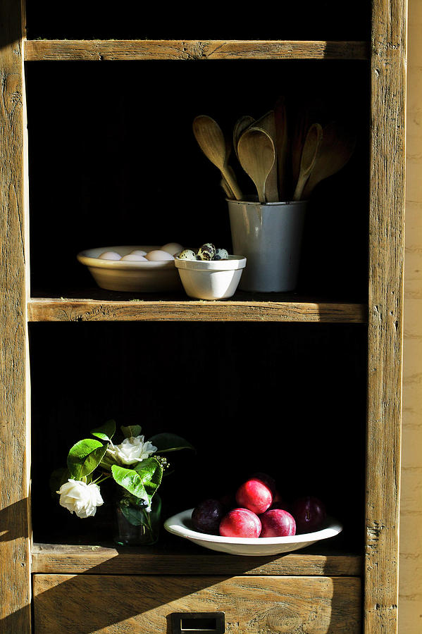 Kitchen Storecupboard Of Fruit And Utensils Photograph by Karen Thomas