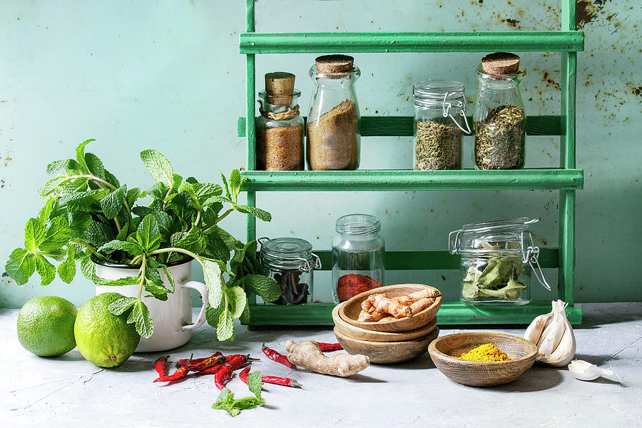 Kitchen Table With Variety Of Spices, Fresh Mint And Limes Photograph by Natasha Breen