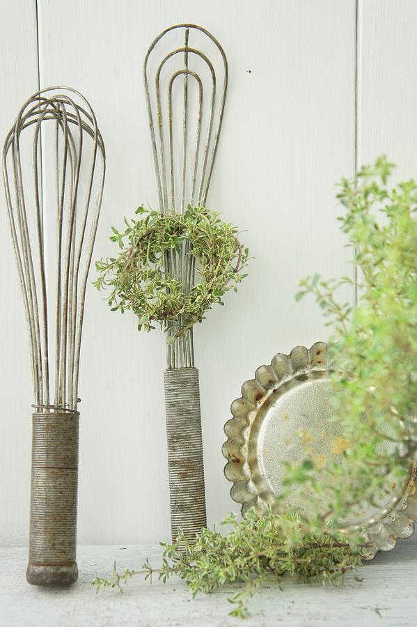 Kitchen Utensils With A Wreath Of Thyme Photograph by Martina Schindler
