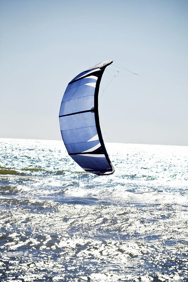 Kite Ski On Blue Sparkling Water Photograph by Kelly Sillaste