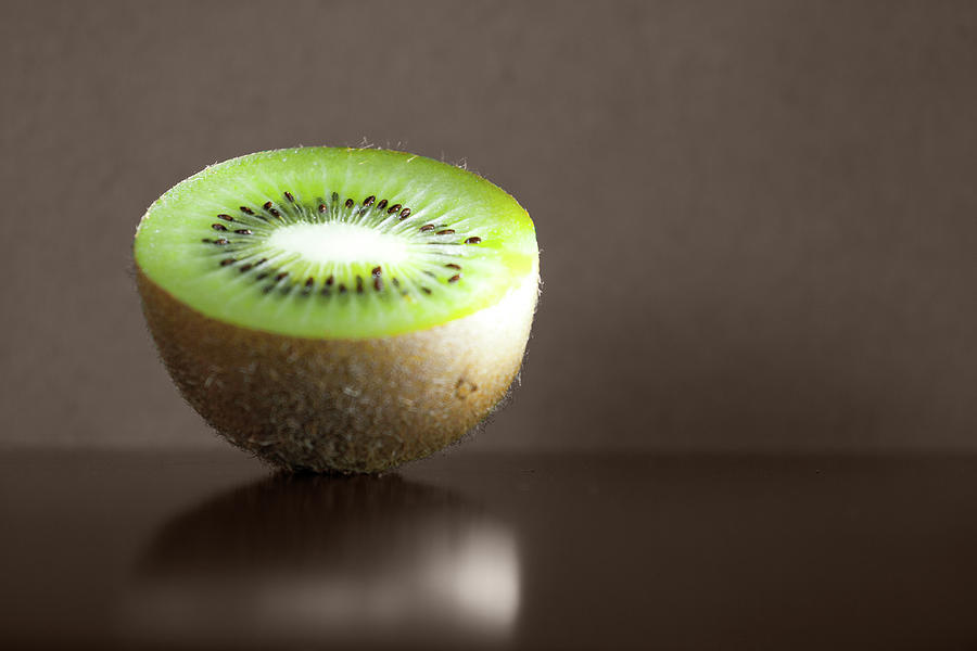 Kiwi Fruit Cut In Half Photograph by By Felix Schmidt