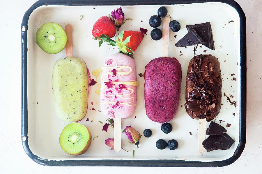 Kiwi, Strawberry, Blueberry And Chocolate Popsicles Photograph by Irina Meliukh