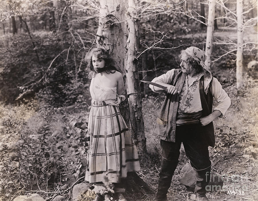 Knife Wielding Pirate With Young Girl Photograph by Bettmann