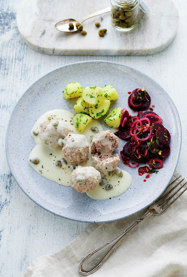 Knigsberger Klopse meatballs In A White Sauce With Capers With Salted Potatoes And A Beetroot Salad Photograph by Stefan Schulte-ladbeck