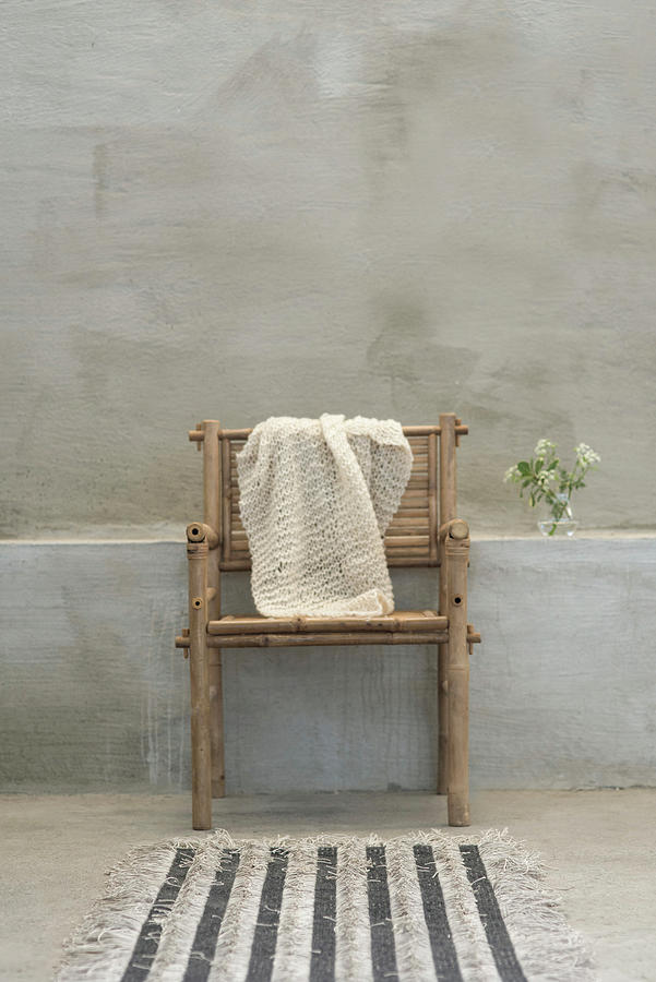 Knitted Cloth On Bamboo Chair Photograph by Magdalena Bjrnsdotter