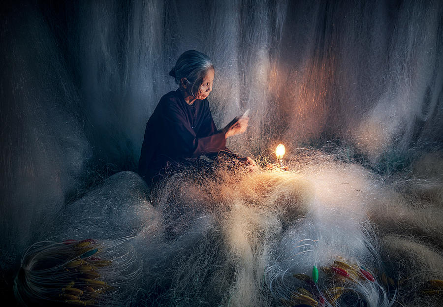 Knitting Fish Nets Photograph by Nguyen Tan Tuan