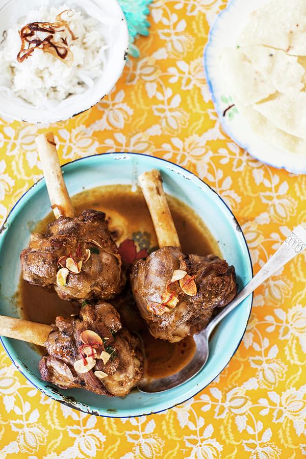 Knuckles Of Lamb With Almonds, Rice And Poppadoms Photograph by Helen Cathcart