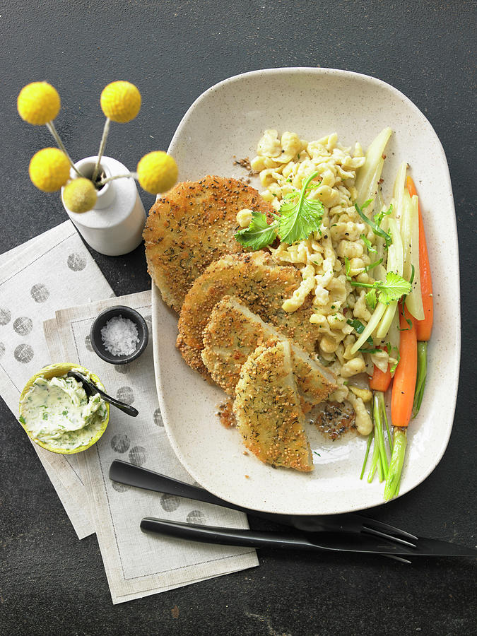Kohlrabi Escalope With A Crispy Mustard Coating With Sptzle soft Egg Noodles From Swabia In Garlic Butter And Spring Carrots Photograph by Jan-peter Westermann
