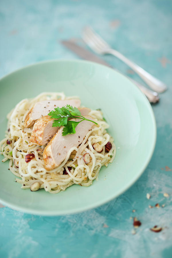 Kohlrabi Noodles With Onions, Hazelnuts And Chicken Breast Photograph by Jan Wischnewski