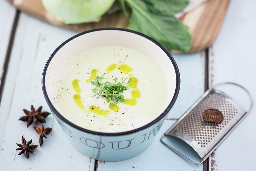 Kohlrabi Soup With Cress, Olive Oil, Nutmeg And Star Anise Photograph by Jan Wischnewski