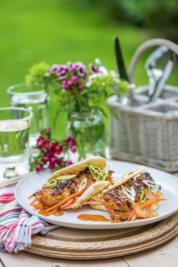 Korean Grilled Chicken Kebabs With Kimchi In Pitta Bread Photograph by Winfried Heinze