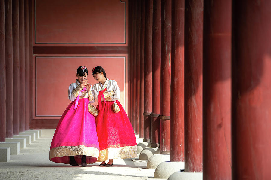 Korean lady in Hanbok or Korea gress and walk in an ancient town Photograph by Anek Suwannaphoom