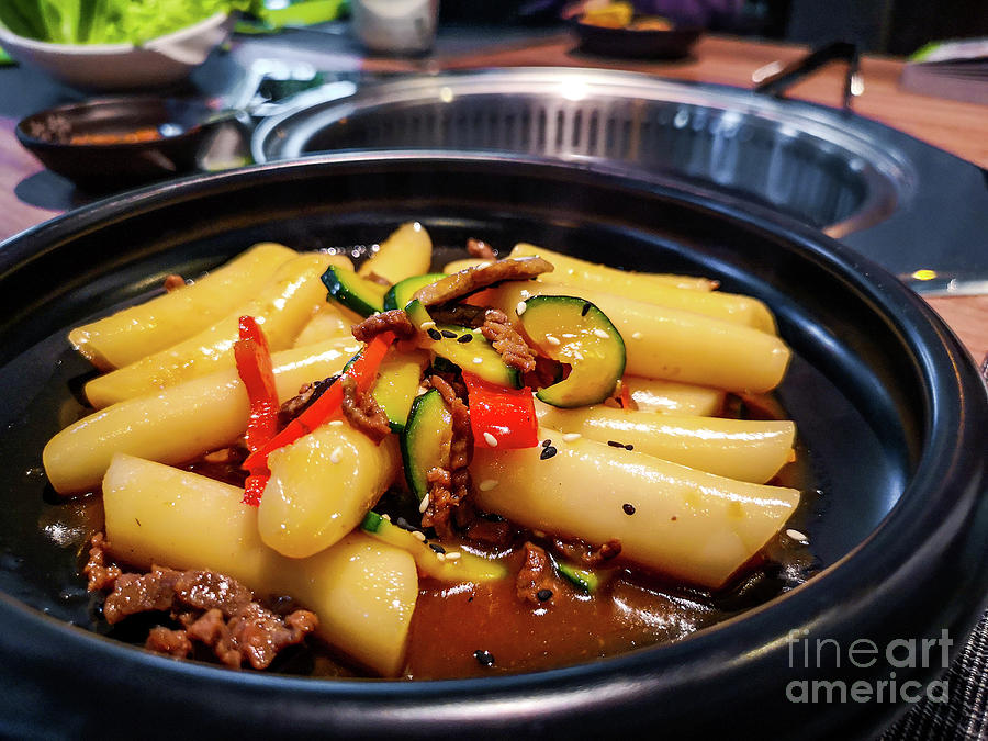 Korean Tteokbokki rice dumplings black dish in an korean ethnic restaurant with sweet ganjang soy sauce meat and zucchini bell peppers veggies Photograph by Luca Lorenzelli