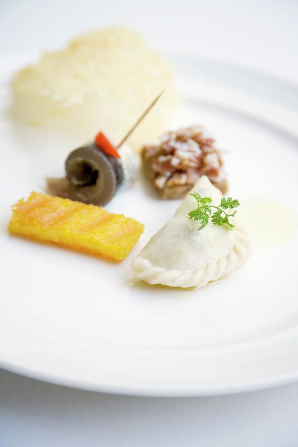 Krntner Nudel austrian Ravioli Filled With Quark And Potatoes With Polenta And Sardine Rolls Photograph by Michael Wissing