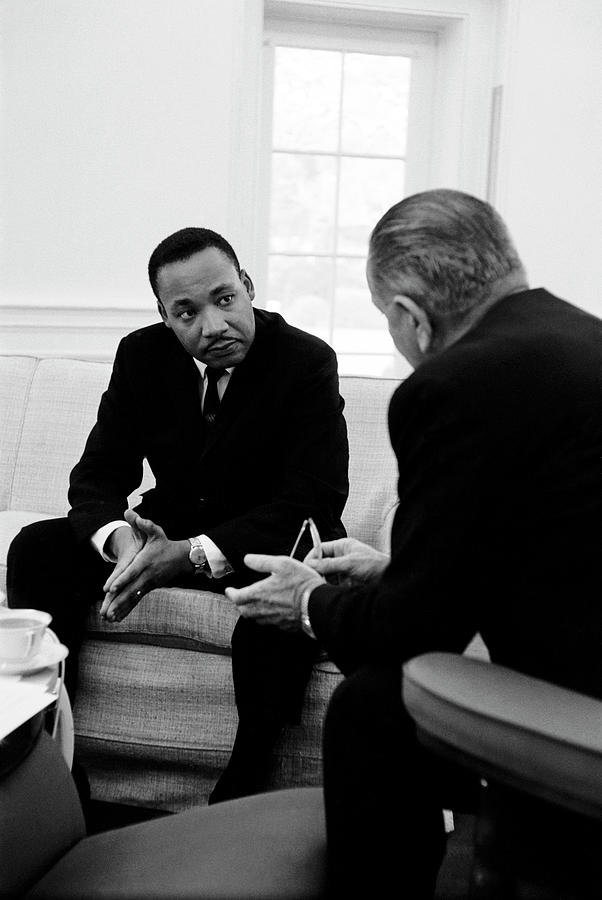 Lyndon Johnson Photograph - (L-R) Civil Right leader Dr. Martin Luther King speaking w. President Lyndon Johnson during a visit to the White House. by Stan Wayman