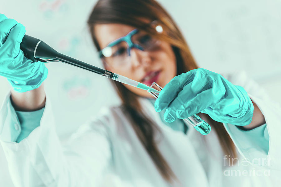 Laboratory Technician Using Micropipette Photograph by Microgen Images/science Photo Library