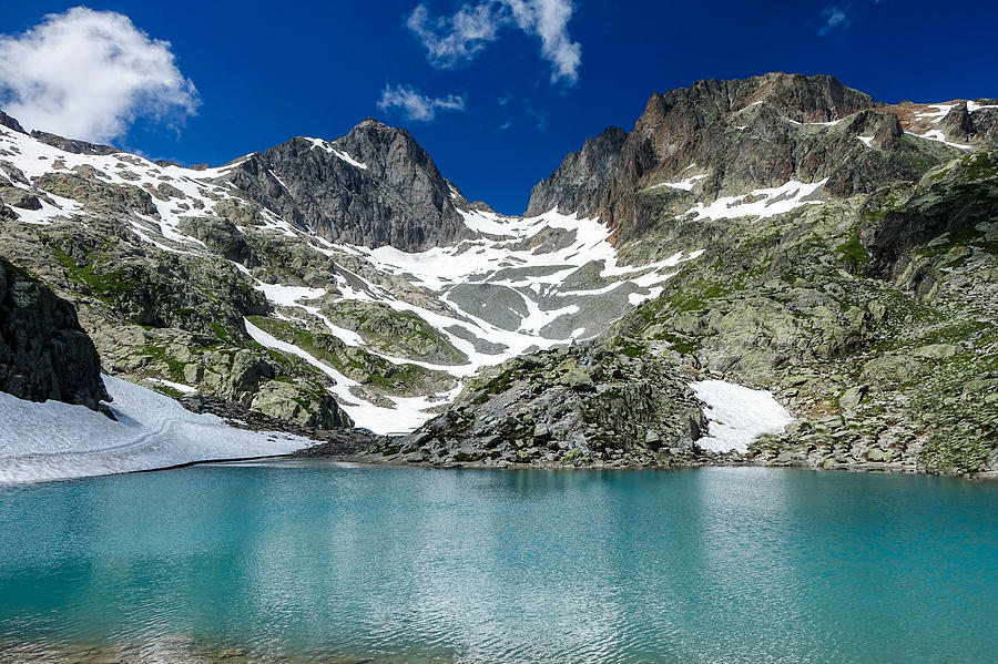 Winter Photograph - Lac blanc in France seen on a beautiful sunny summer day. by George Afostovremea