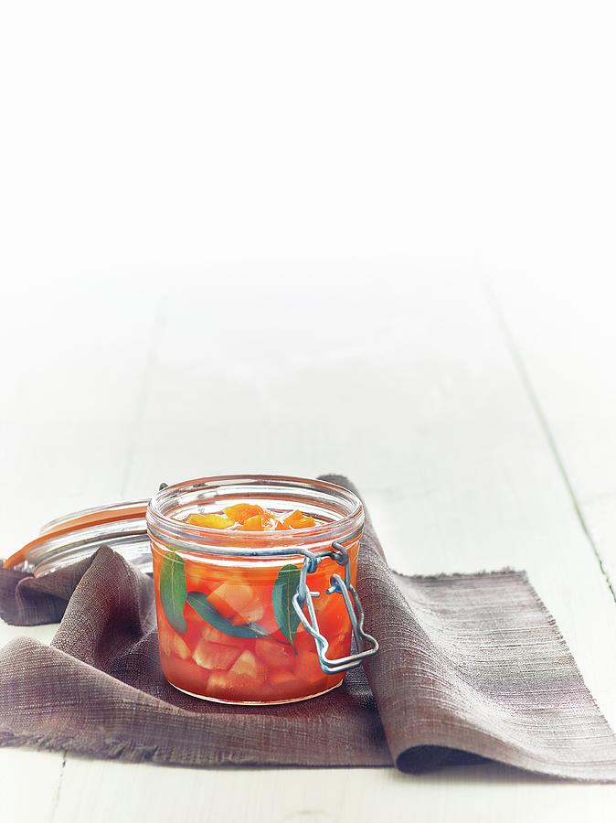 Lacto Fermented Orange Peppers With Bay Leaves Photograph by Frdric Perrin