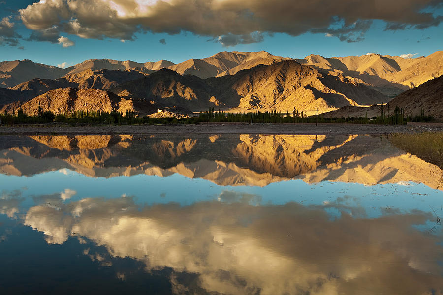 Ladakh Range Reflected In Village Pond Photograph by Richard Ianson