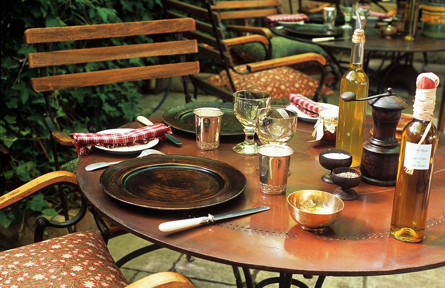Laid Table On The Terrace Of A French Restaurant Photograph by Dieterich, Werner