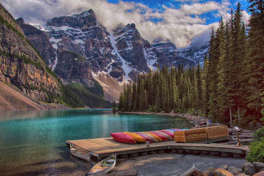Lake Moraine Canoes Canadian Rockies Photograph by Dave Dilli