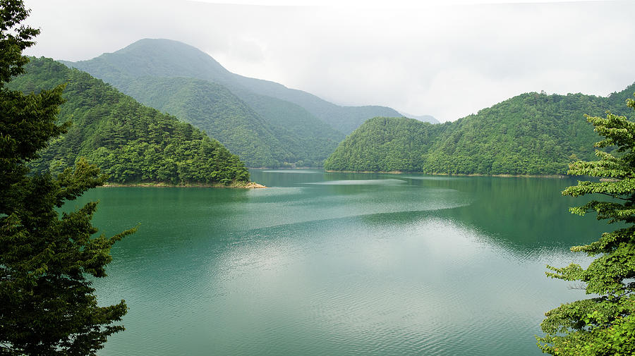 Lake Surrounded By Forested Mountains Photograph by Ippei Naoi