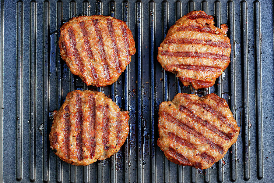 Lamb Cakes On A Grill Grid Photograph by Petr Gross