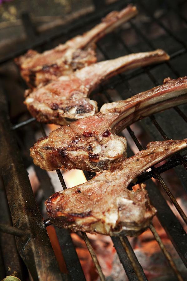 Lamb Chops On A Barbecue Photograph by Alex Hinchcliffe