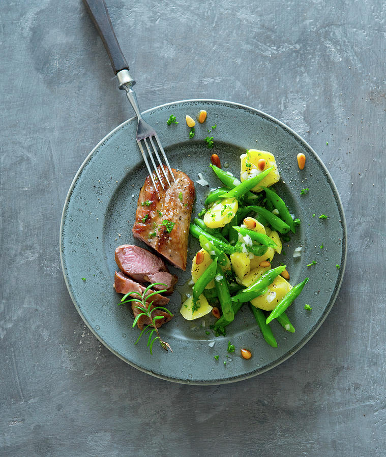 Lamb Fillet And Italian Bean And Potato Salad Photograph by Udo Einenkel