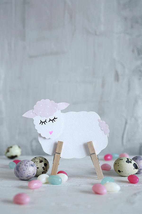 Lamb Made From Paper And Clothes Pegs Amongst Easter Eggs Photograph by Thordis Rggeberg
