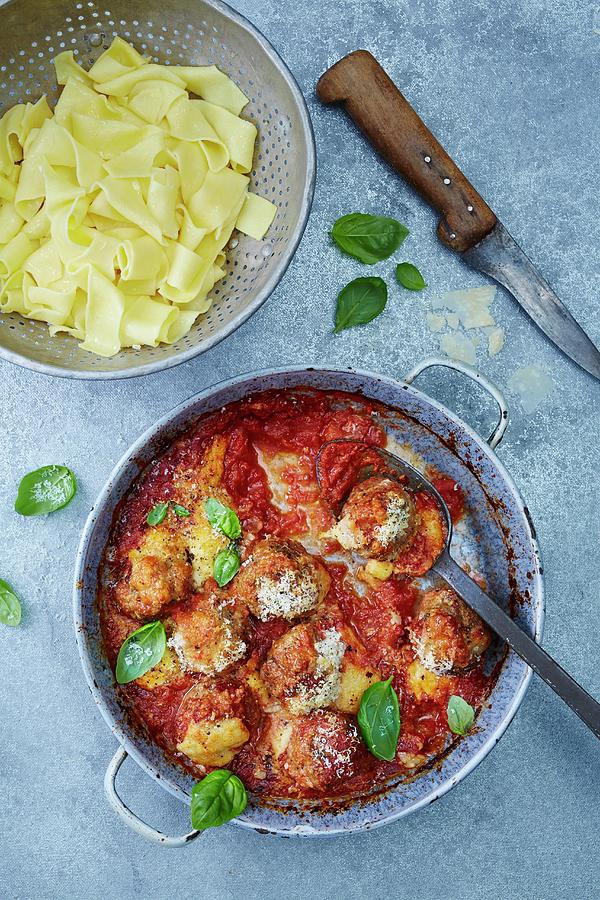 Lamb Meatballs With Cheese And Tomato Sauce Served With Tagliatelle Photograph by Clive Streeter