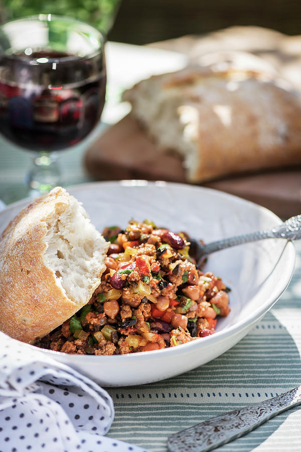 Lamb Mince With Vegetables, Kidney Beans And Bread On An Outdoor Table Photograph by Winfried Heinze
