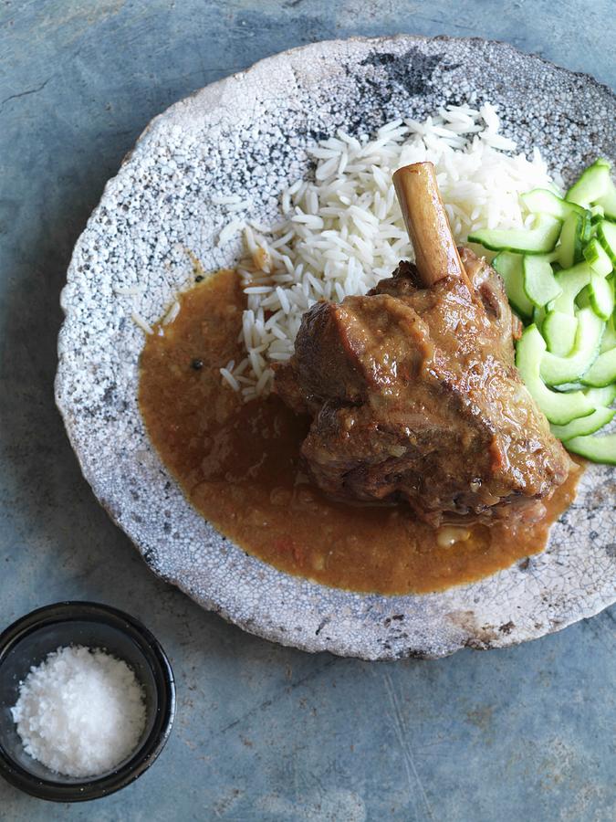 Lamb Shank Curry With Rice And Cucumber india Photograph by Jonathan Gregson