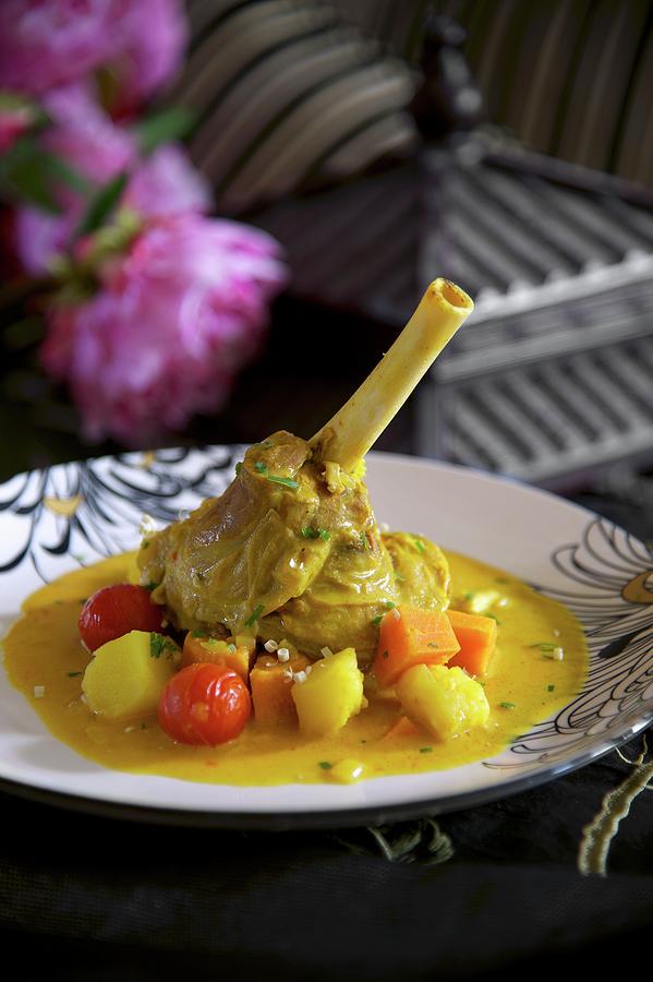 Lamb Shank With Curried Vegetables Photograph by Heinze, Winfried Fine Art America