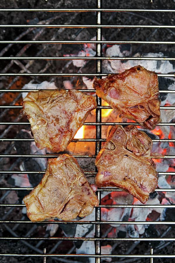 Lamb Steaks On A Barbecue Photograph by Petr Gross