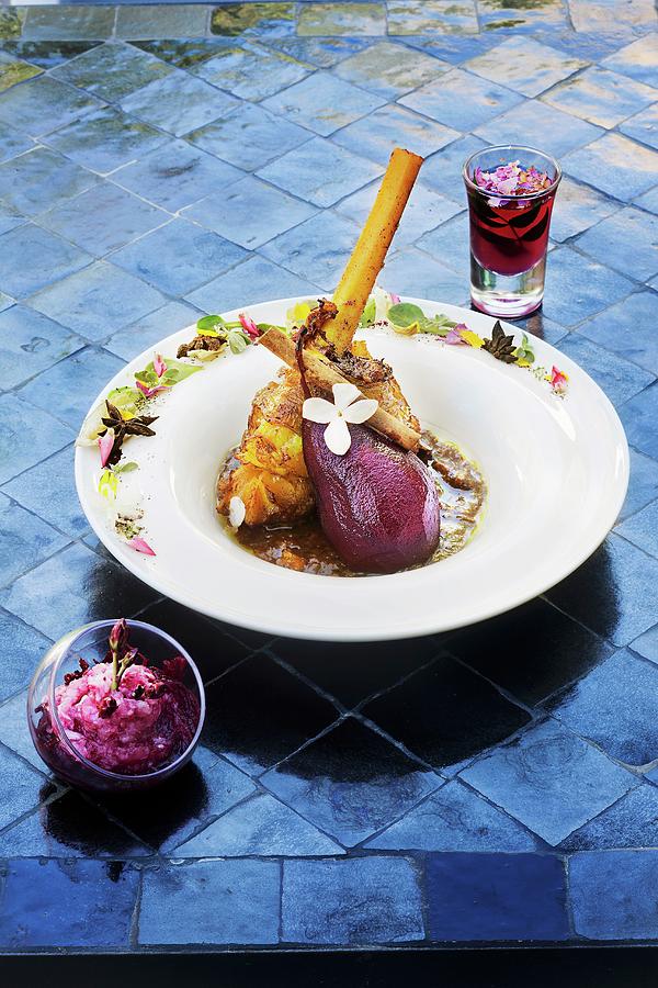 Lamb Tagine With A Red Wine Pear At Latitude 31 Photograph by Jalag / Markus Bassler