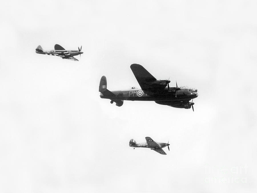Lancaster bomber flanked by Spitfire and Hurricane fighter. Photograph by Doc Braham