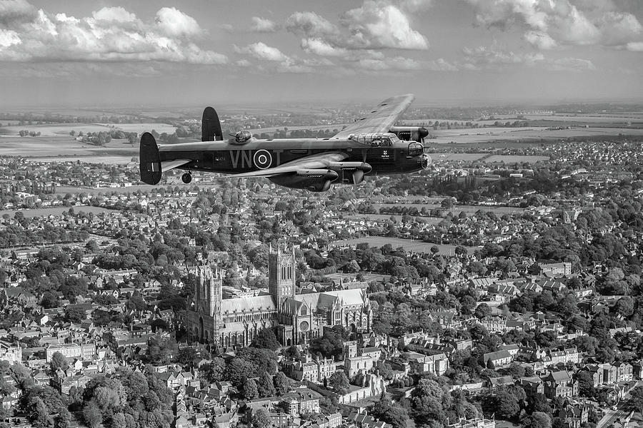 Lancaster City of Lincoln over the City of Lincoln black and white Photograph by Gary Eason