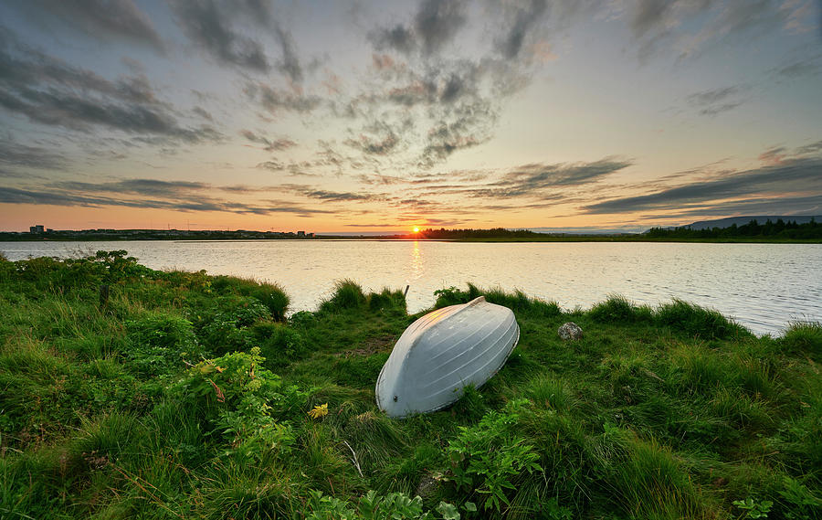 Nature Photograph - Landscape Of Summer Coast Of Lake With Overturned Boat On Sunset by Cavan Images