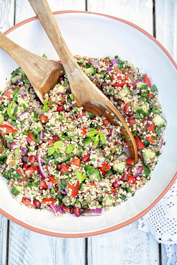 Large Bowl Of Lebanese Tabbouleh Salad With Bulgur Wheat, Tomatoes, Cucumber, Onion, Pomegranate Photograph by Lucy Parissi