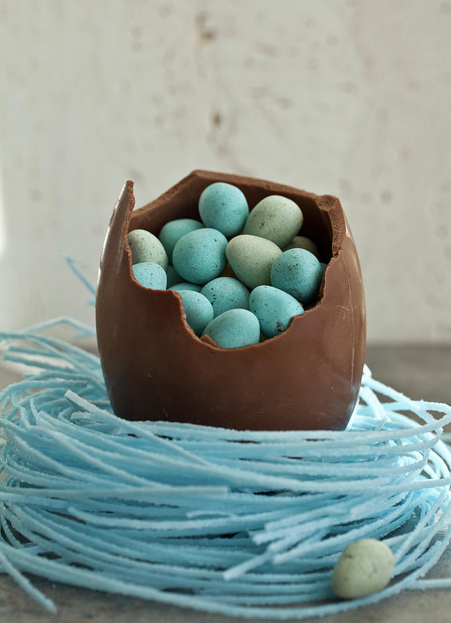 Large Chocolate Easter Egg, Sitting In A Blueberry Candy Nest, Filled With Mini Chocolate Eggs Photograph by Ryla Campbell