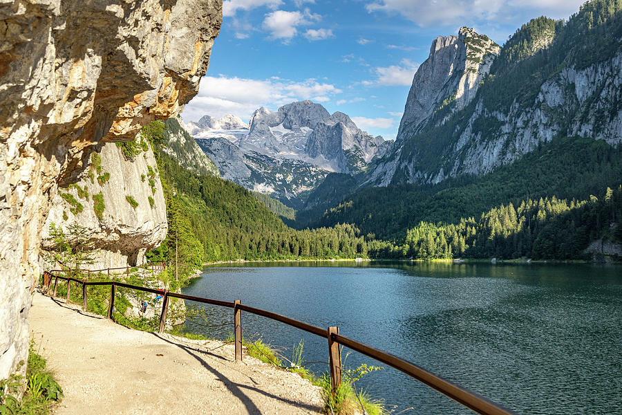 Large Gosau Lake With Climbing Walls And A Path In The Foreground. View Of The Dachstein Massif, Salzkammergut, Upper Austria. Photograph by Franz Subauer