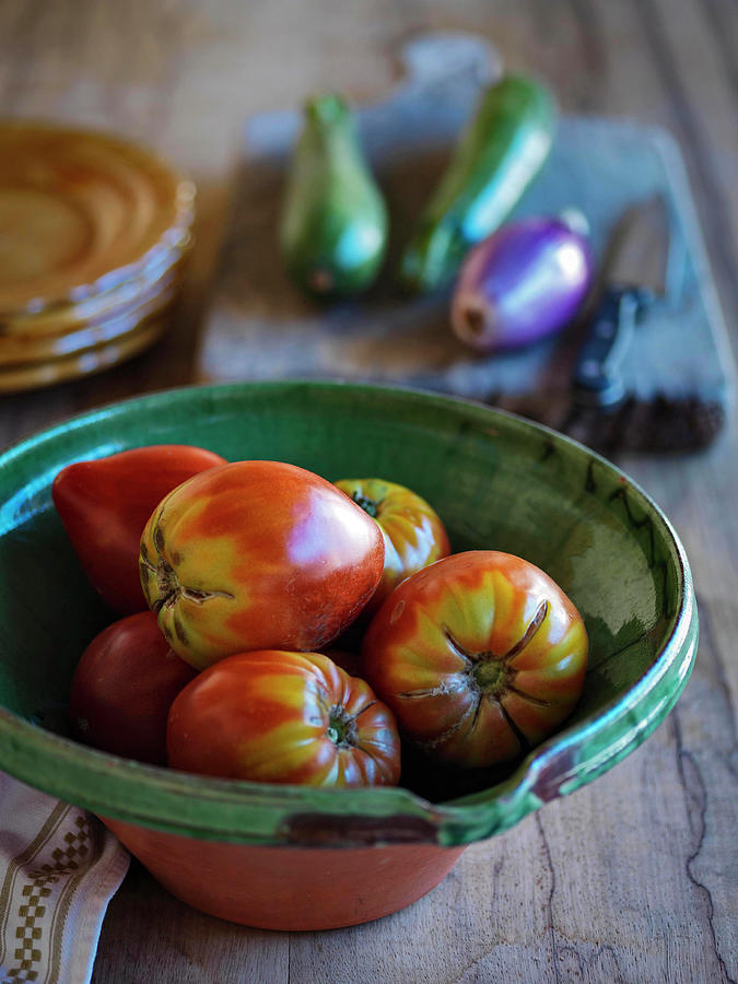 Large Plum Tomatos In A Rustic Bowl Photograph by Michael Paul